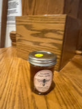 12 oz Tricounty Farm honey jar with honeycomb, featuring a golden amber color and a rustic glass design.
