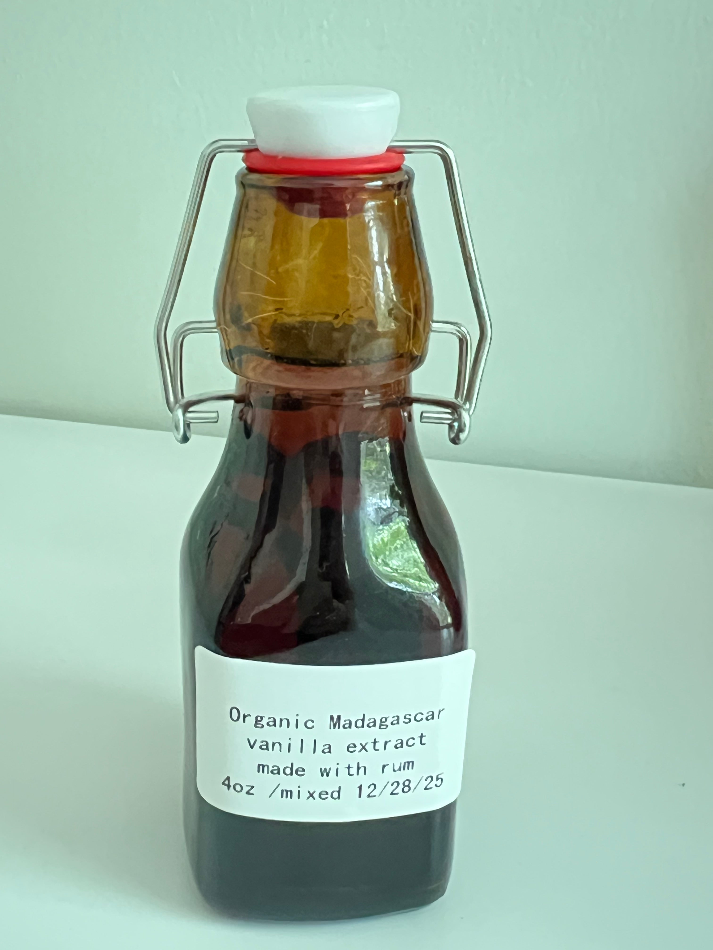 4 oz bottle of Tricounty Farm organic Madagascar vanilla extract blended with rum, rich brown color, created Dec 2025.