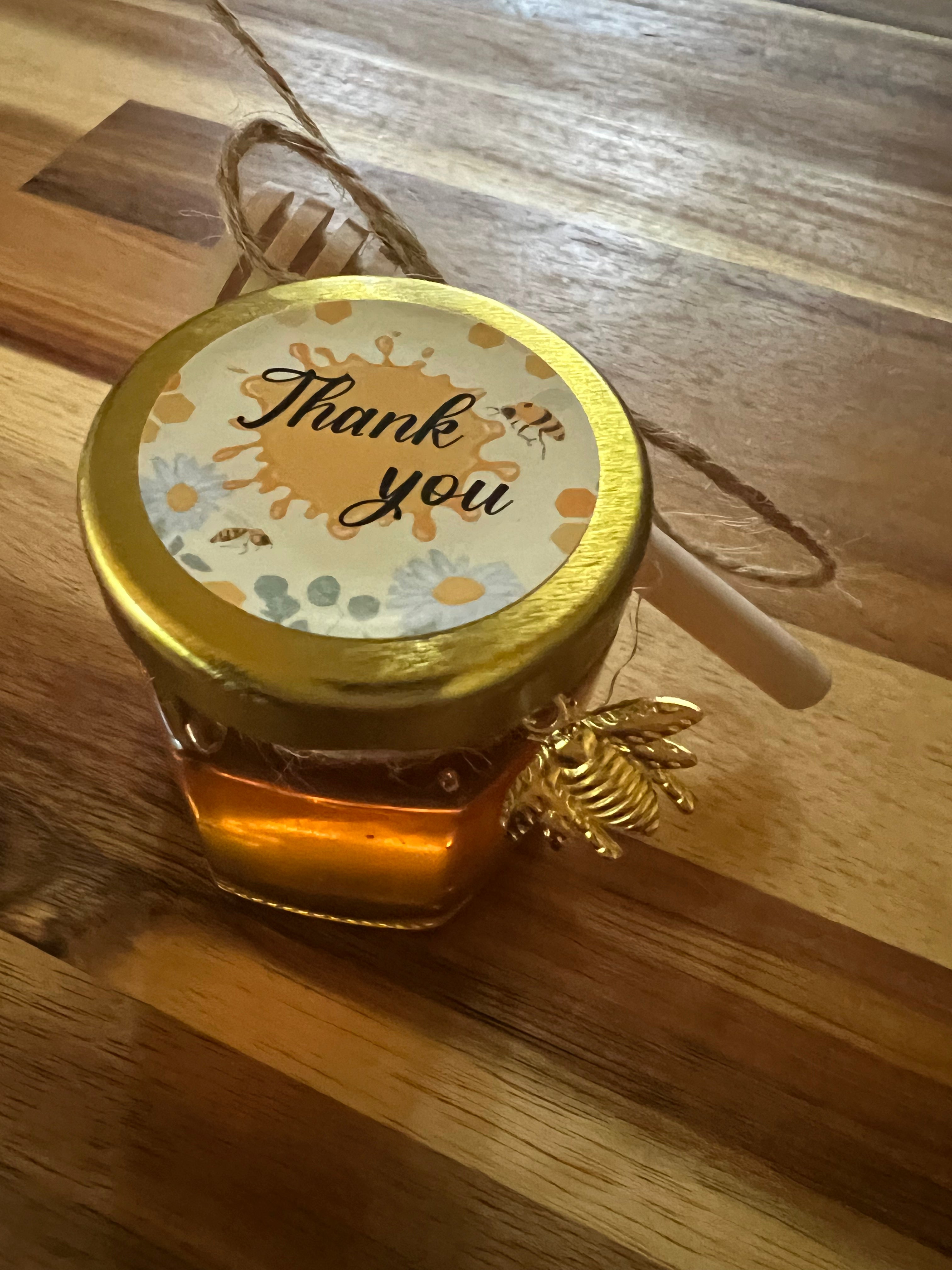 Tiny 1.5-ounce honey pot from Tricounty Farm, featuring a rustic design and golden honey inside.
